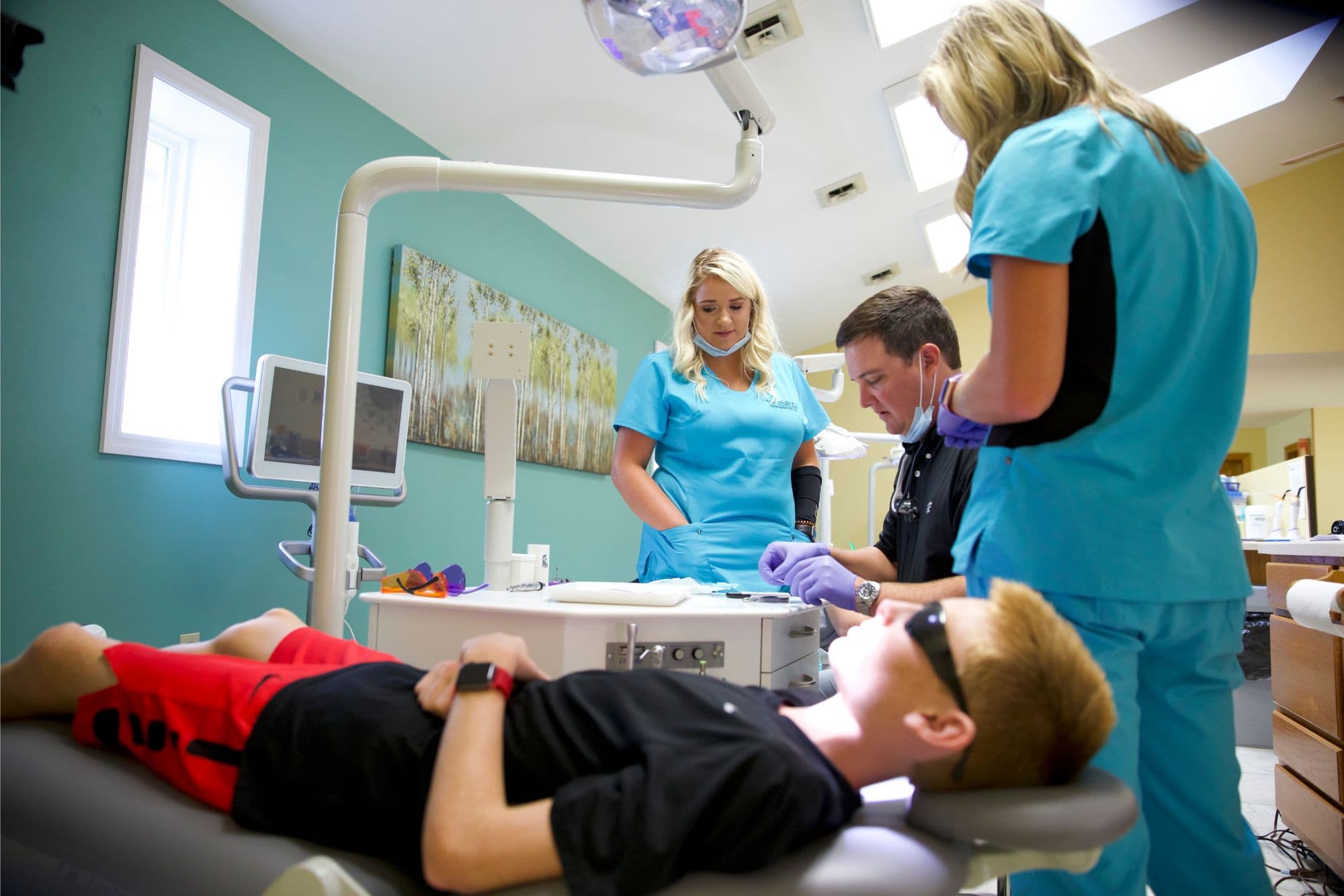 Westfall Orthodontics staff with a patient